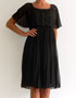 robe noire avec manches a volants en location